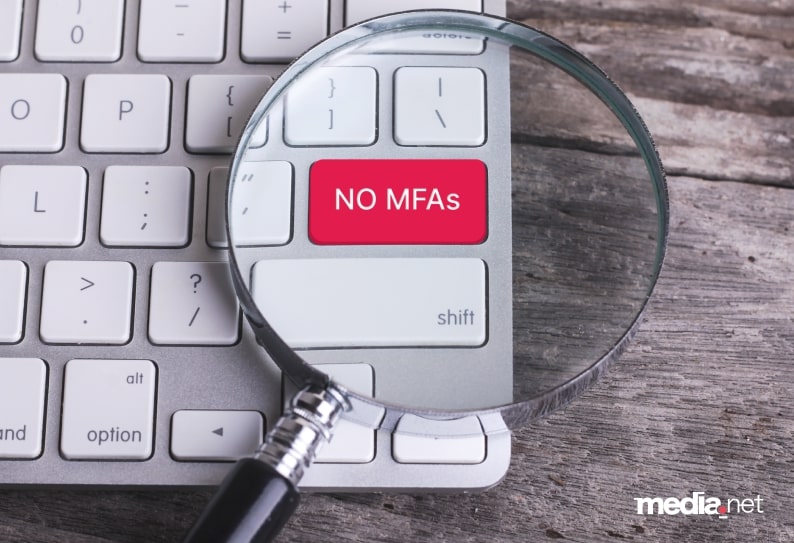 Media.net visual emphasizing its stance against Made for Advertising (MFA) sites, featuring a red 'NO MFAs' key on a keyboard under a magnifying glass 